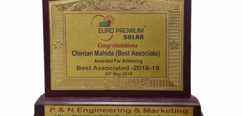 Wooden award plaque recognizing Chintan Mahida as 