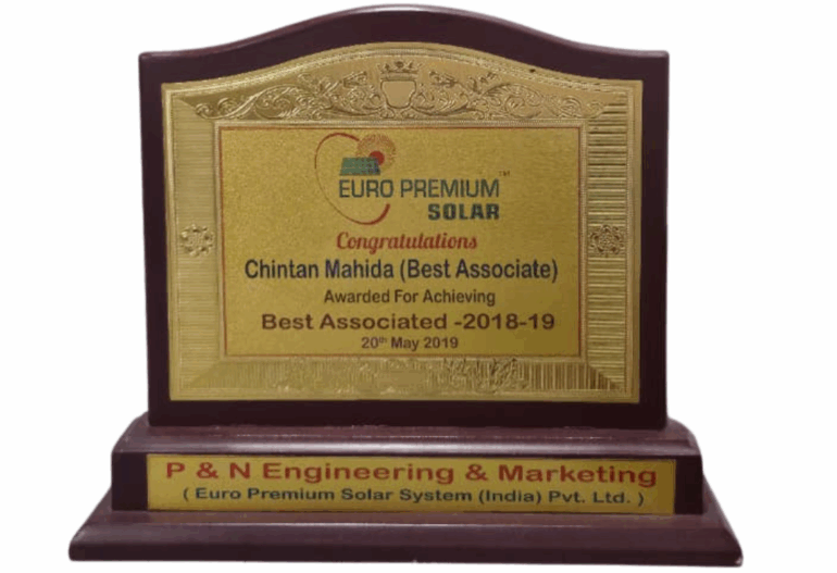 Wooden award plaque recognizing Chintan Mahida as 
