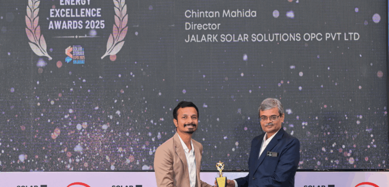Chintan Mahida receiving the Young Leader of the Year 2025 Award on stage from a presenter at the Energy Excellence Awards.