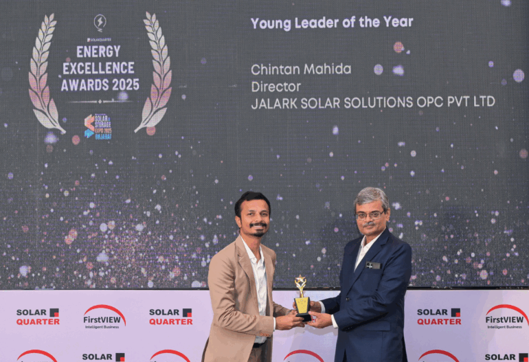 Chintan Mahida receiving the Young Leader of the Year 2025 Award on stage from a presenter at the Energy Excellence Awards.