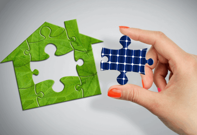 A hand holding a puzzle piece shaped like a solar panel, connecting it to a larger puzzle piece shaped like a green house, symbolizing smart integration.